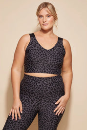 A model wearing the Antidote Crop in colour Leopardsmk (Grey), from the front, cropped image