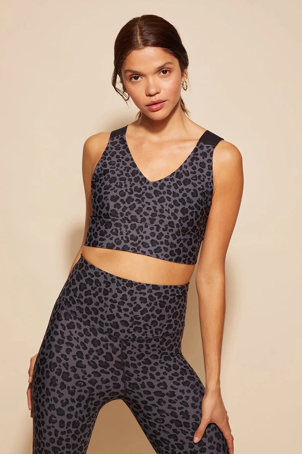 A model wearing the Antidote Crop in colour Leopardsmk (Grey), from the front, cropped image