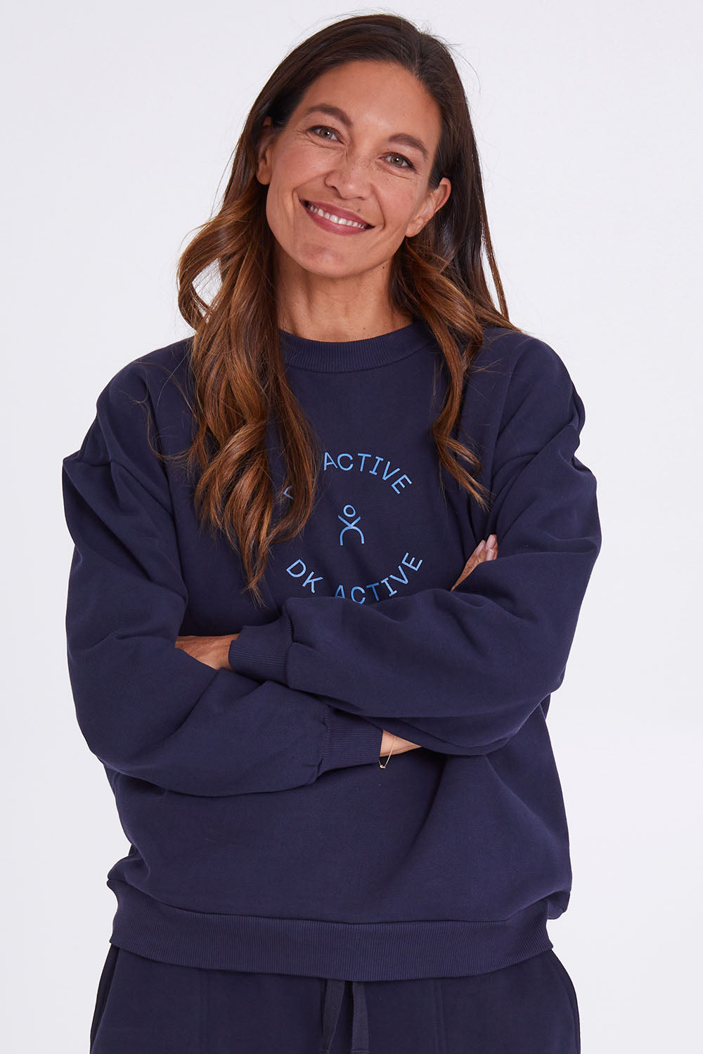 Model Alex wearing the Sonny Jumper in colour Navy (Blue), from the front, cropped image