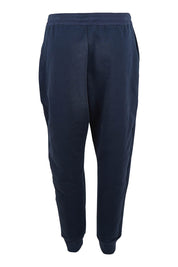 Product shot of the Nova Pant in colour Navy (Blue), from the back