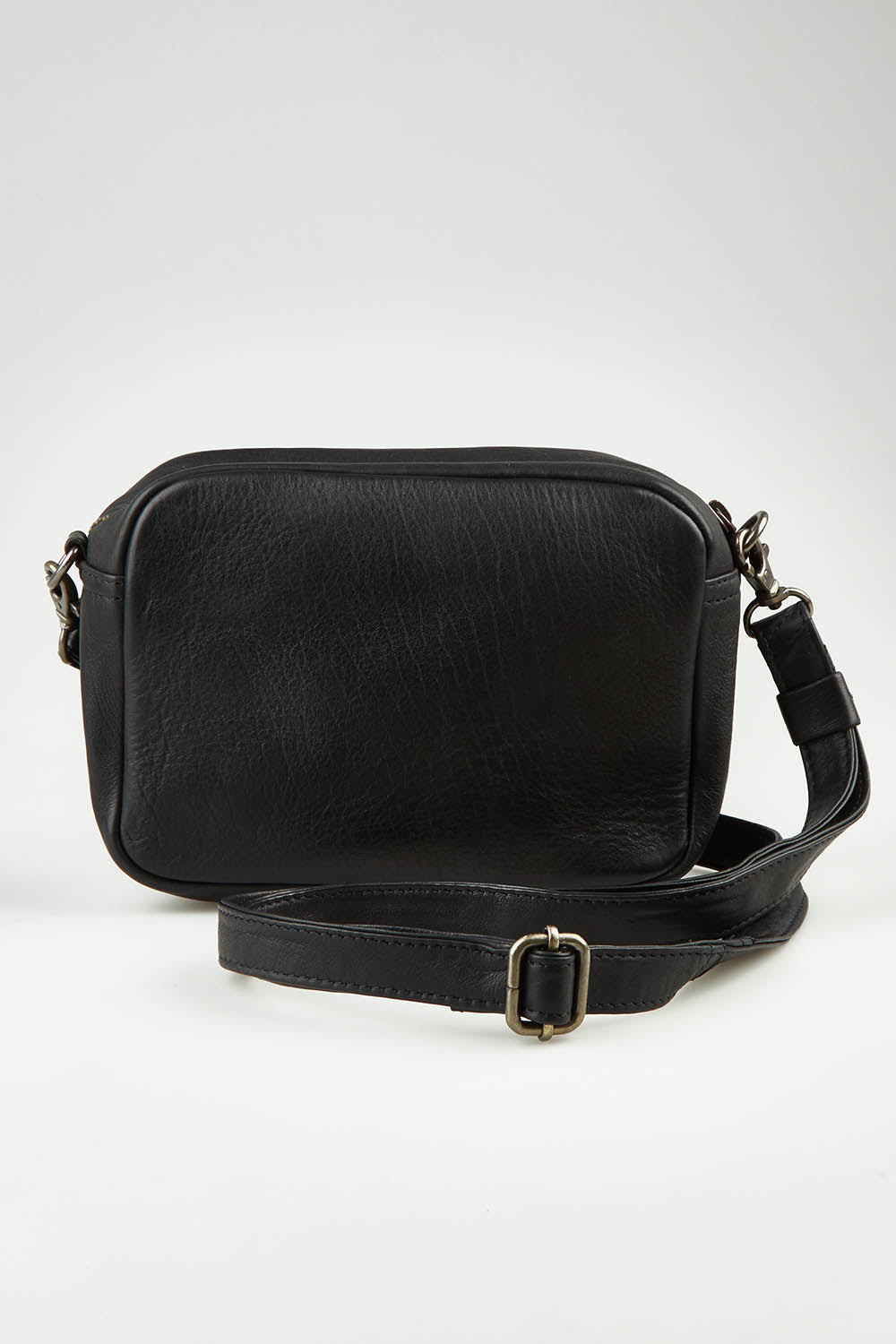 A model wearing size OneSize of the Head In The Clouds Leather Bag in colour Black (Black), from the front, showing the whole outfit