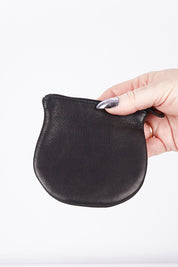 A model wearing size OneSize of the Lilly Leather Coin Purse in colour Black (Black), from the front, showing the whole outfit