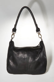 A model wearing size OneSize of the Poppy Leather Bag in colour Black (Black), from the front, showing the whole outfit