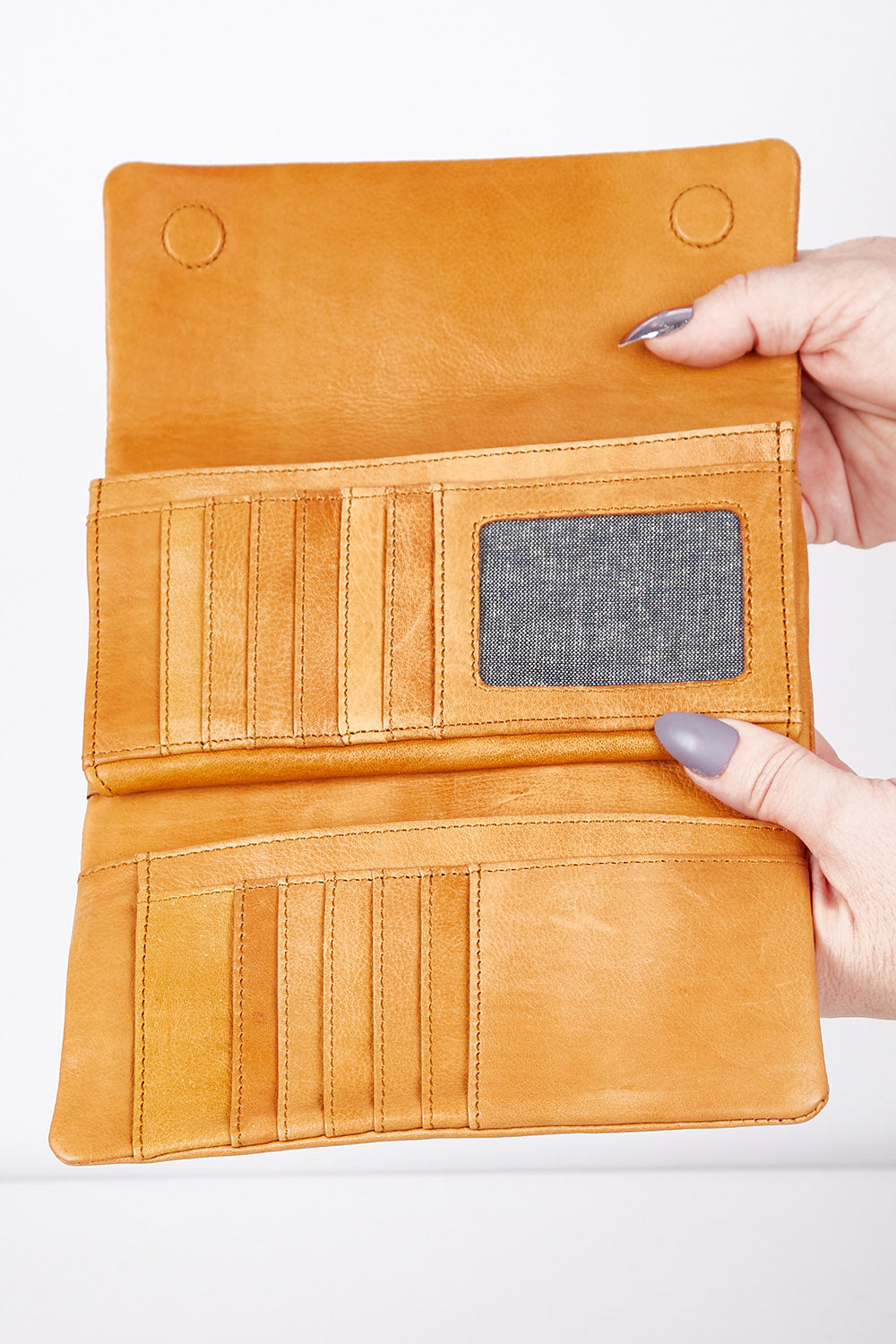 A model wearing size OneSize of the Rose Leather Purse in colour Tan, from the front, showing the whole outfit