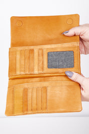 A model wearing size OneSize of the Rose Leather Purse in colour Tan, from the front, showing the whole outfit