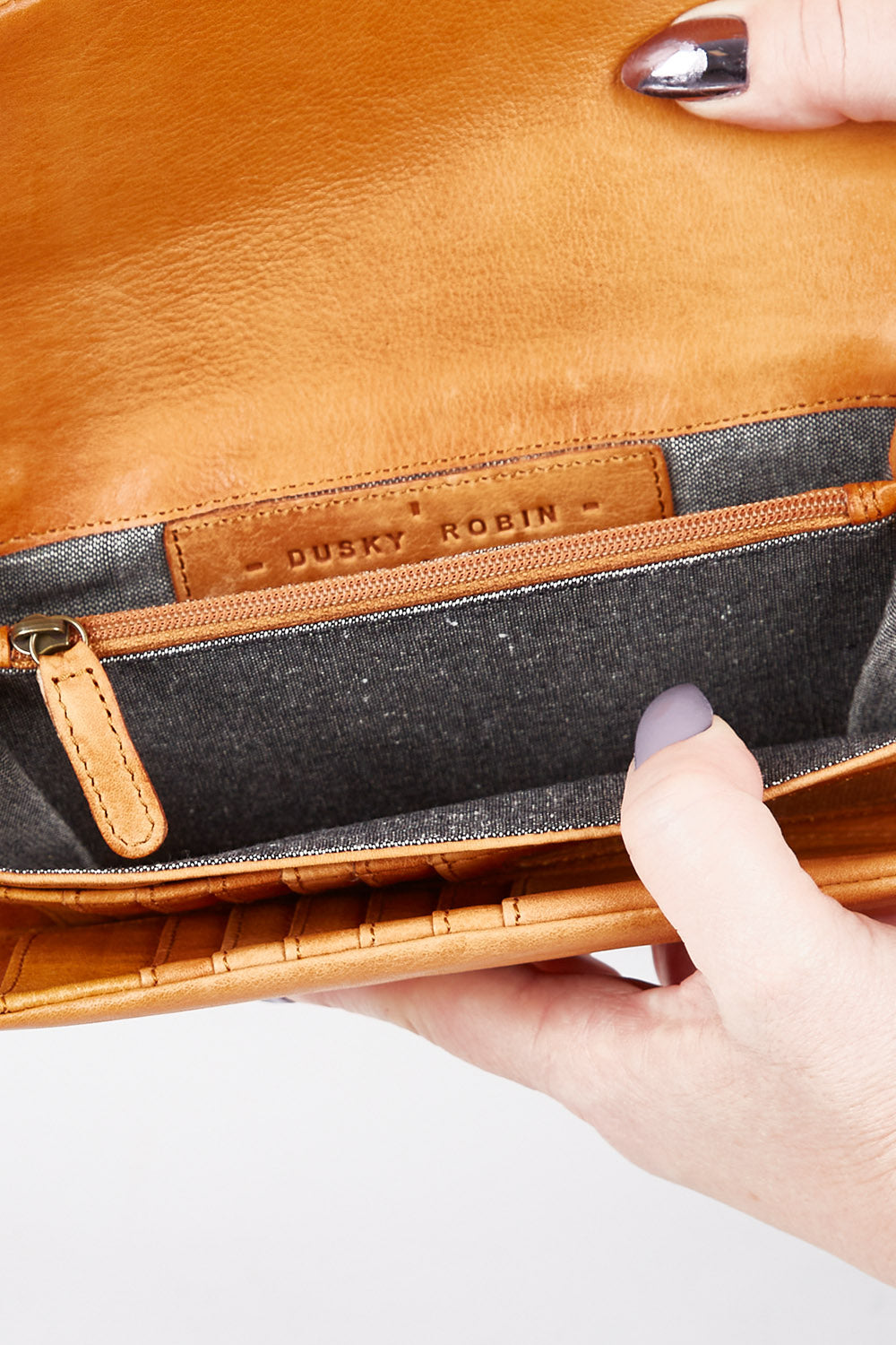 A model wearing size OneSize of the Rose Leather Purse in colour Tan, from the front, showing the whole outfit