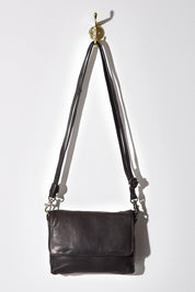 A model wearing size OneSize of the Sara Leather Bag in colour Black (Black), from the front, showing the whole outfit