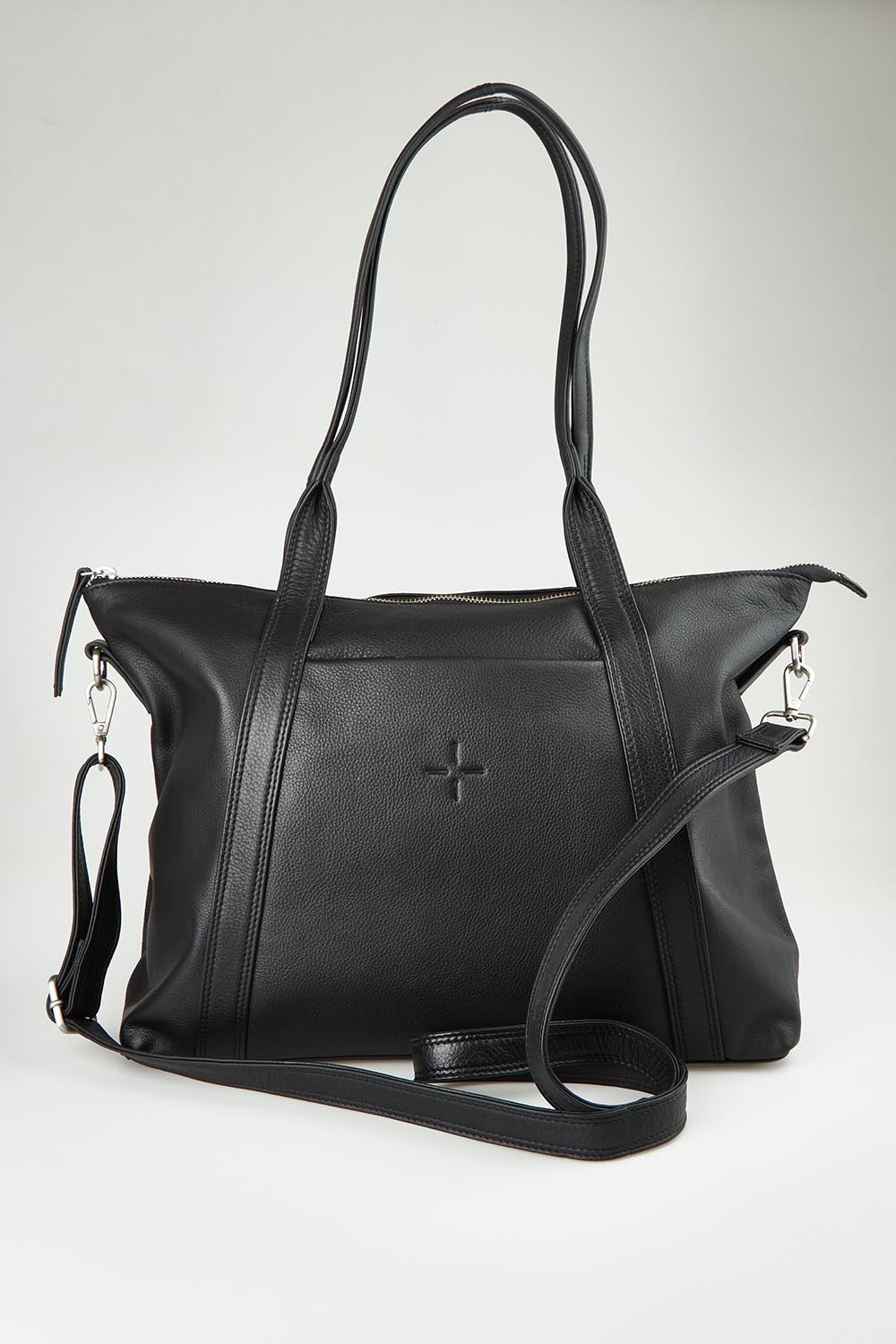 A model wearing the Valentina Leather Tote in colour Black (Black), from the front, showing the whole outfit