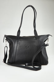 A model wearing the Valentina Leather Tote in colour Black (Black), from the front, showing the whole outfit