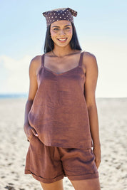Model Eshan wearing size 10 of the Studio Linen Tank – Chocolate in colour Chocolate, in a cropped view