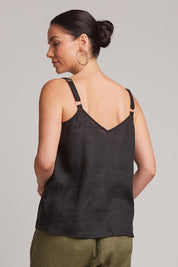 A model wearing the Studio Linen Tank in colour Ebony (Black), from the back