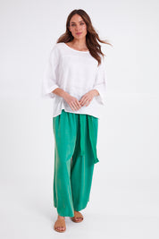 Model Madeline wearing size OneSize of the Studio Relaxed Top in colour Salt (White), from the front, showing the whole outfit