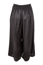 Product shot of the Studio Crop Pant in colour Ebony (Black), from the back