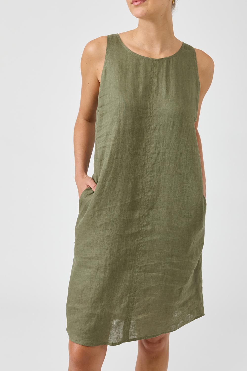 A model wearing the Studio Linen Midi Dress in colour Khaki (Green), from the front, cropped image