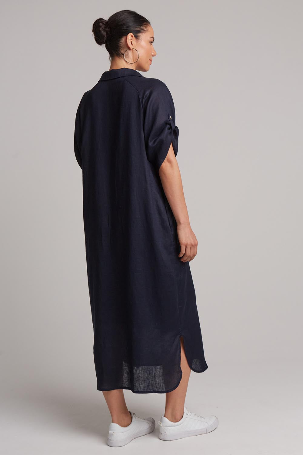 A model wearing the Studio Shirt Dress in colour Navy (Blue), from the back