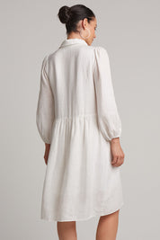 A model wearing the Studio Linen Midi Shirt Dress in colour Salt (White), from the back