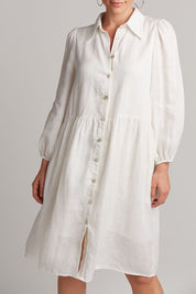 A model wearing the Studio Linen Midi Shirt Dress in colour Salt (White), from the front, cropped image