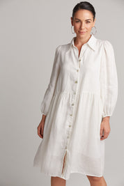 A model wearing the Studio Linen Midi Shirt Dress in colour Salt (White), from the front, cropped image