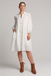 A model wearing the Studio Linen Midi Shirt Dress in colour Salt (White), from the front, showing the whole outfit