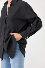 A model wearing the Studio Oversize Cotton Shirt in colour Ebony (Black), from the front, cropped image