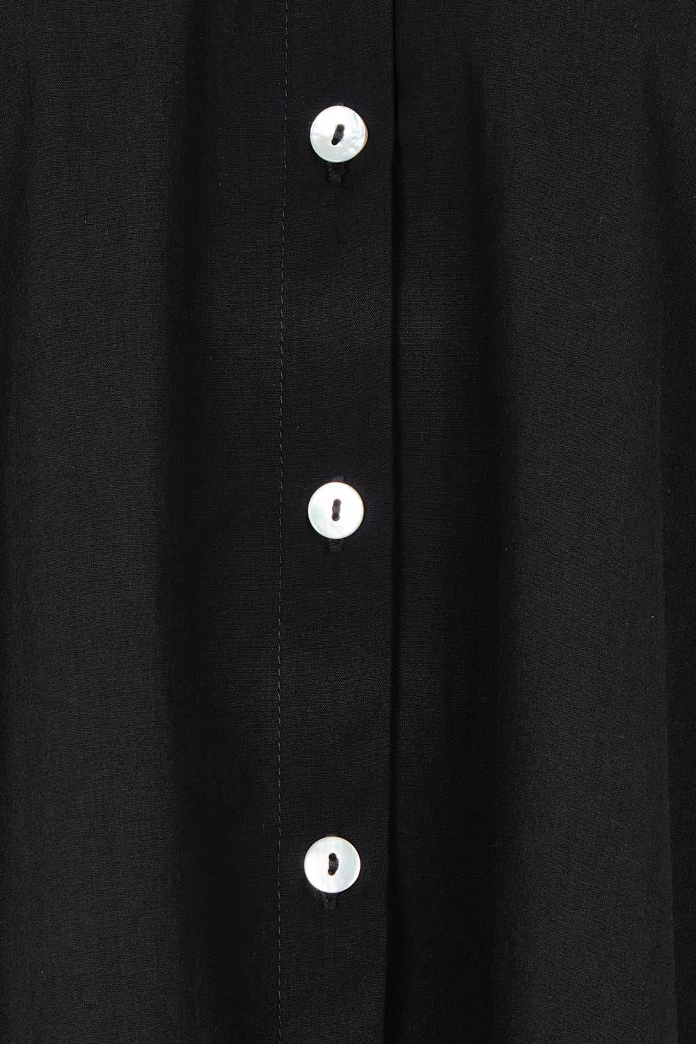 Product shot of the Studio Oversize Cotton Shirt in colour Ebony (Black), detail