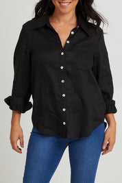 Model Katie wearing size S of the Studio Linen Shirt in colour Ebony (Black), from the front, cropped image