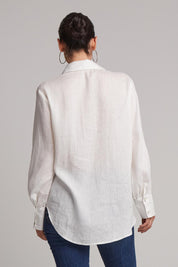 A model wearing the Studio Linen Shirt in colour Salt (White), from the back