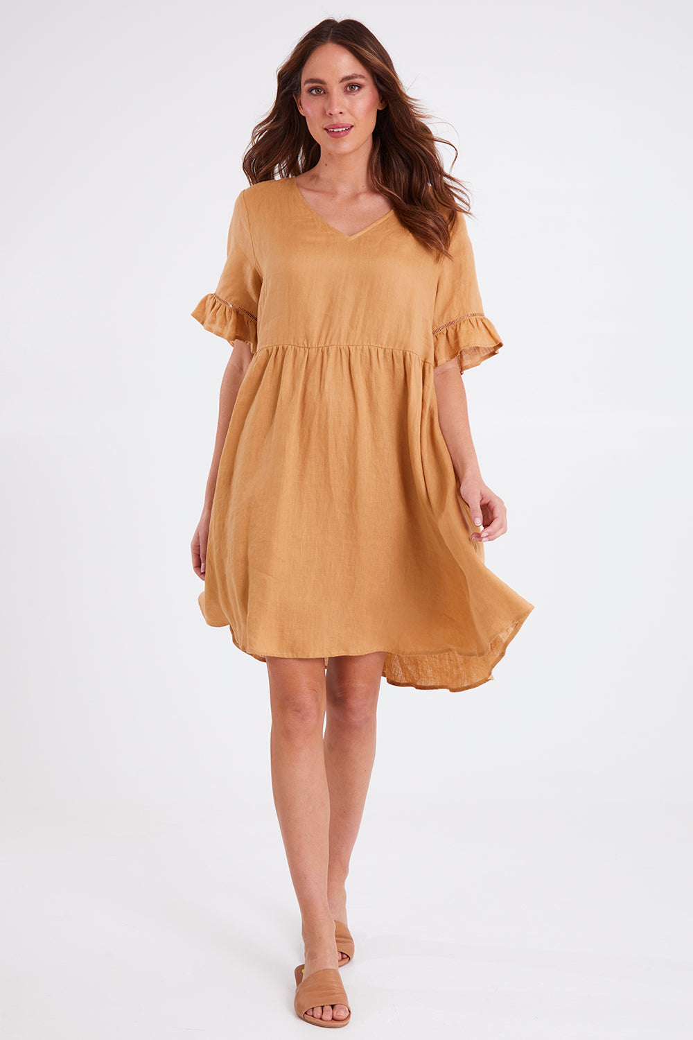 Model Madeline wearing size S of the La Vie Dress in colour Caramel, from the front, showing the whole outfit