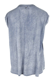 Product shot of the Elan Top in colour Denim (Blue), from the back