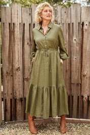 A model wearing the Nama Shirt Dress in colour Fern (Green), from the front, showing the whole outfit