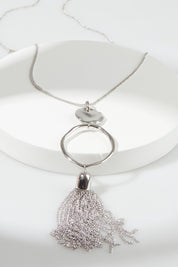 A model wearing the Meta Large Necklace in colour Silver (Metallics), from the front, showing the whole outfit
