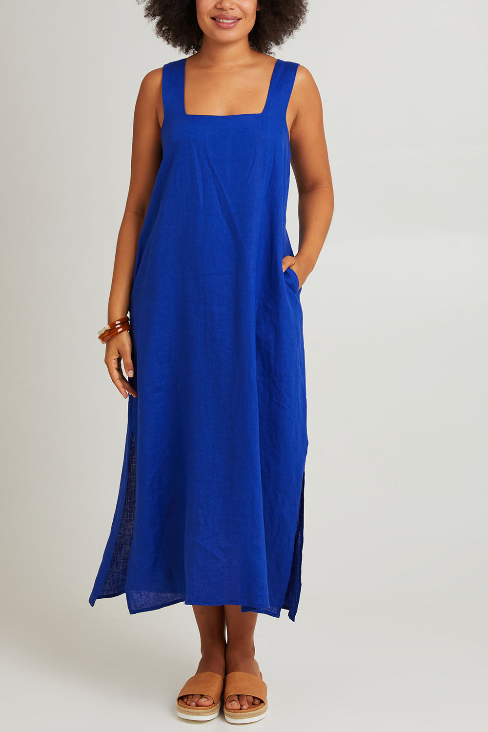 Model Olivia wearing size S of the Halcyon Linen Tank Dress in colour Cobalt (Blue), from the front, cropped image