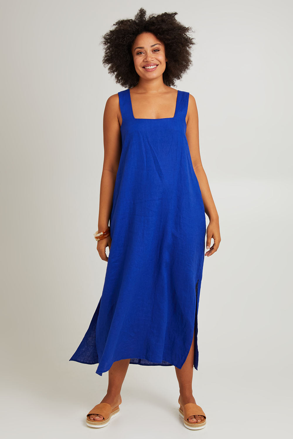 Model Olivia wearing size S of the Halcyon Linen Tank Dress in colour Cobalt (Blue), from the front, showing the whole outfit