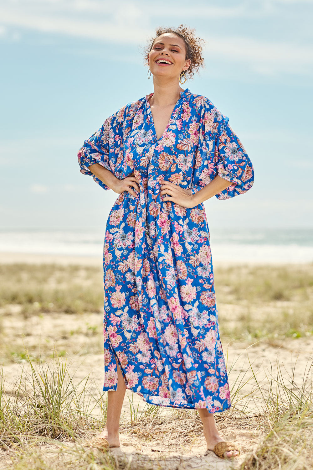 Model Lala wearing size S of the Seraphic Tie Dress in colour Palme (Blue), from the front, showing the whole outfit