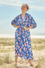 Model Lala wearing size S of the Seraphic Tie Dress in colour Palme (Blue), from the front, showing the whole outfit
