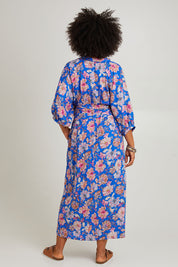Model Olivia wearing size S of the Seraphic Tie Dress in colour Palme (Blue), from the back