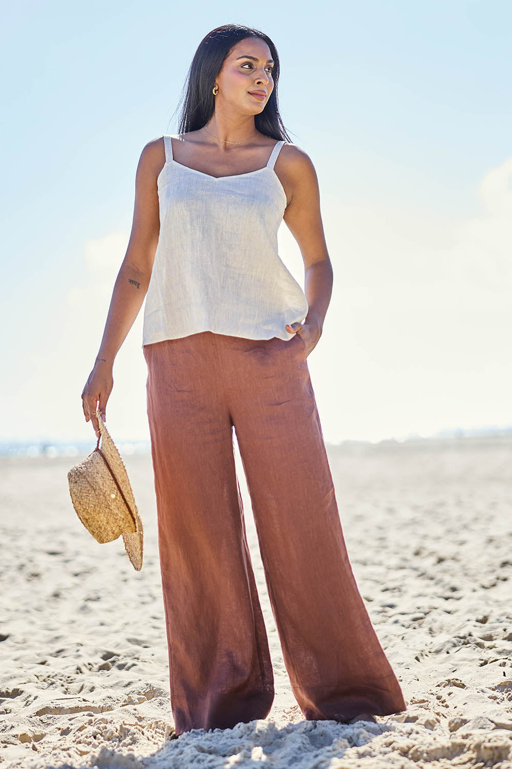 Model Eshan wearing size 10 of the Studio Linen Pant – Chocolate in colour Chocolate, from the front