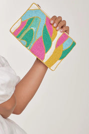 A model wearing the Elysian Beaded Pouch in colour Multi (Pink), from the front, showing the whole outfit