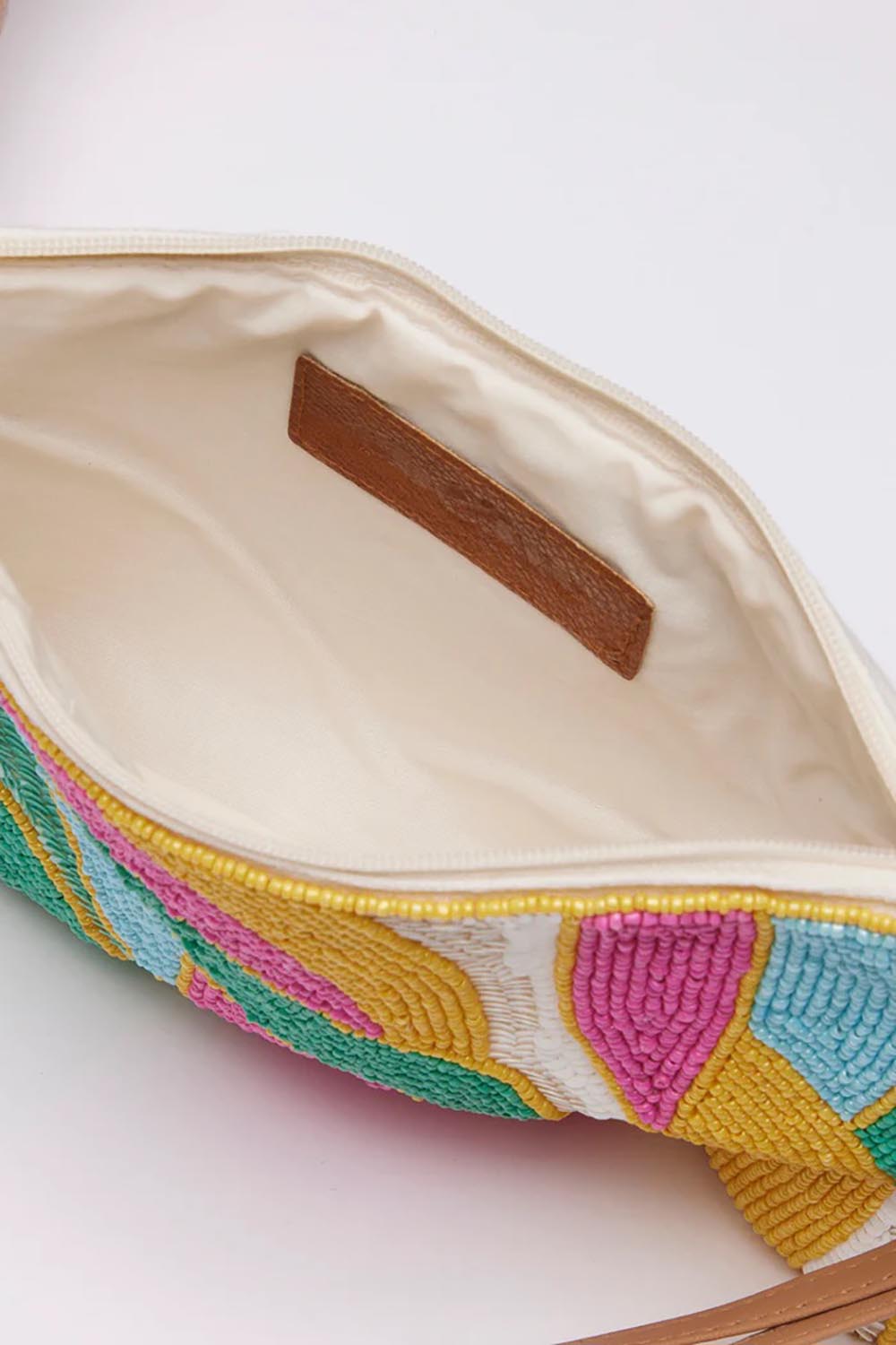 A model wearing the Elysian Beaded Pouch in colour Multi (Pink), from the front, showing the whole outfit