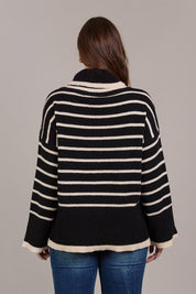 A model wearing the Katana Roll Neck Knit in colour Black (Black), from the back