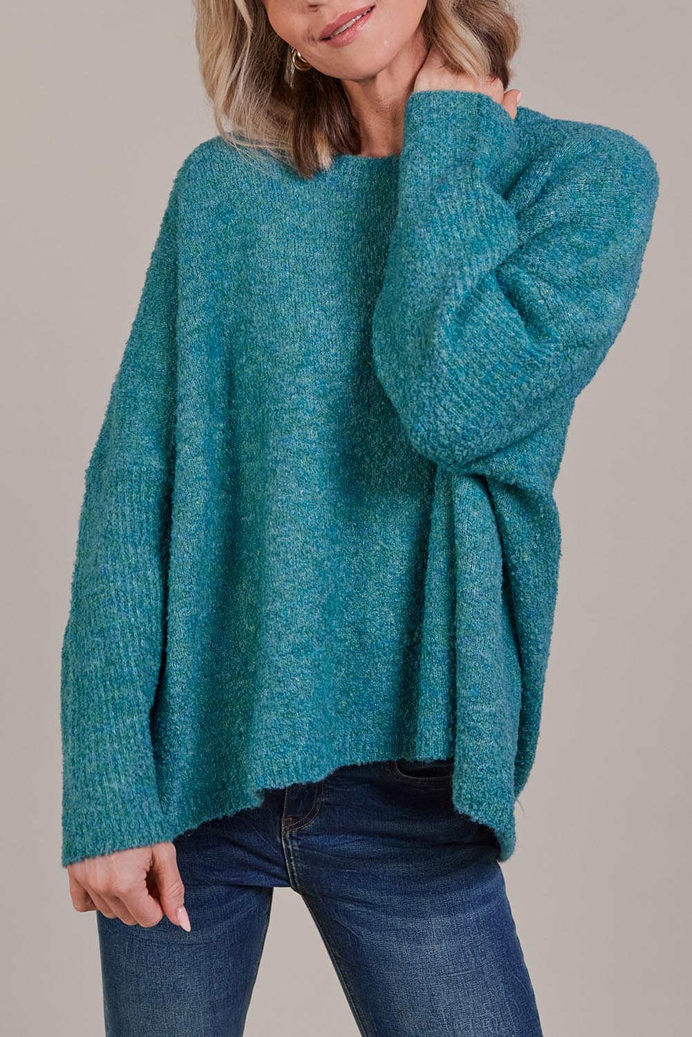 A model wearing the Folie Relaxed Knit in colour Largo (Blue), from the front, cropped image