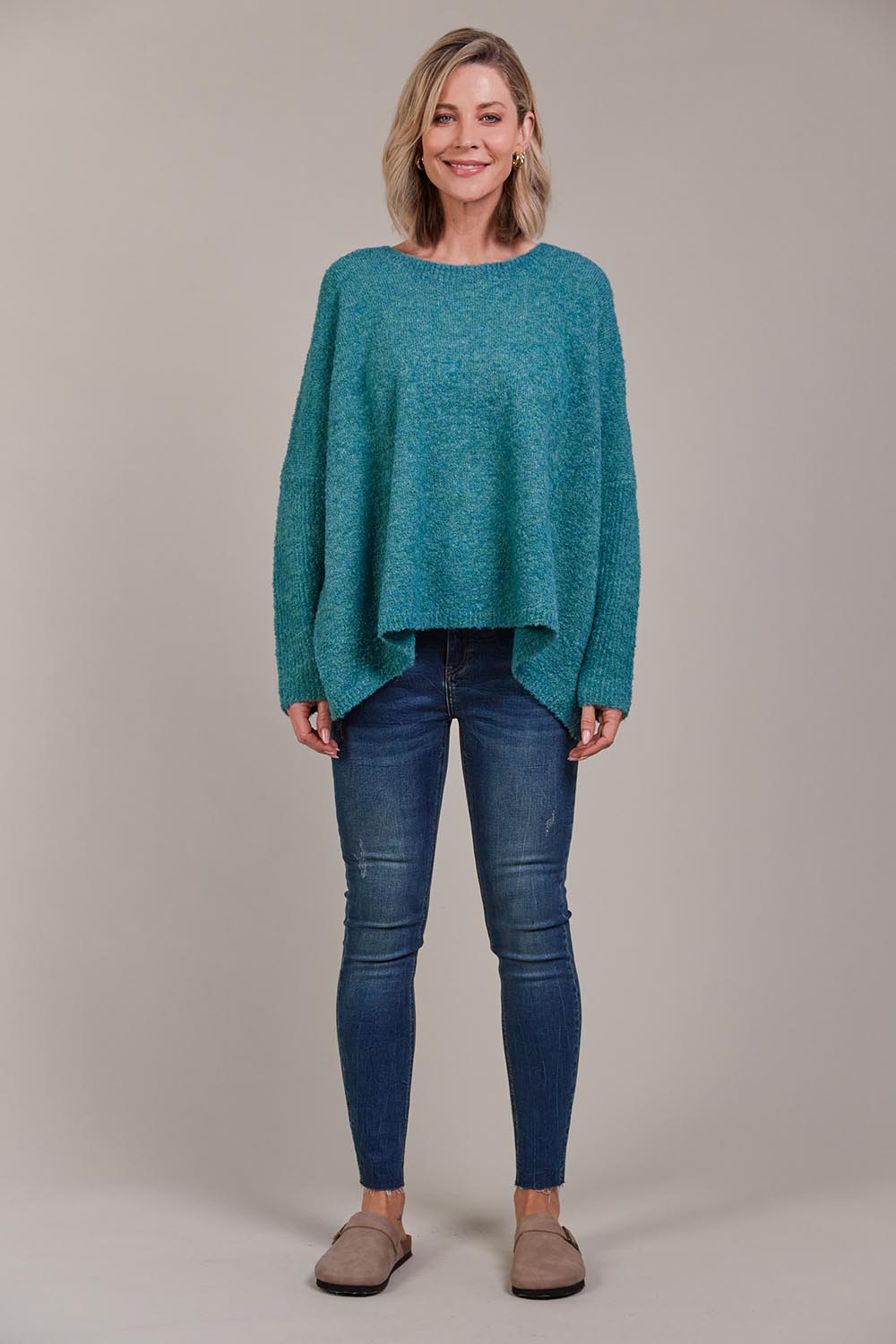 A model wearing the Folie Relaxed Knit in colour Largo (Blue), from the front, showing the whole outfit