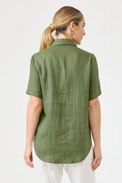 A model wearing the Studio Linen Short Sleeve Shirt in colour Khaki (Green), from the back