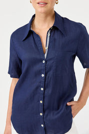 A model wearing the Studio Linen Short Sleeve Shirt in colour Navy (Blue), from the front, cropped image