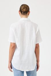 A model wearing the Studio Linen Short Sleeve Shirt in colour White (White), from the back