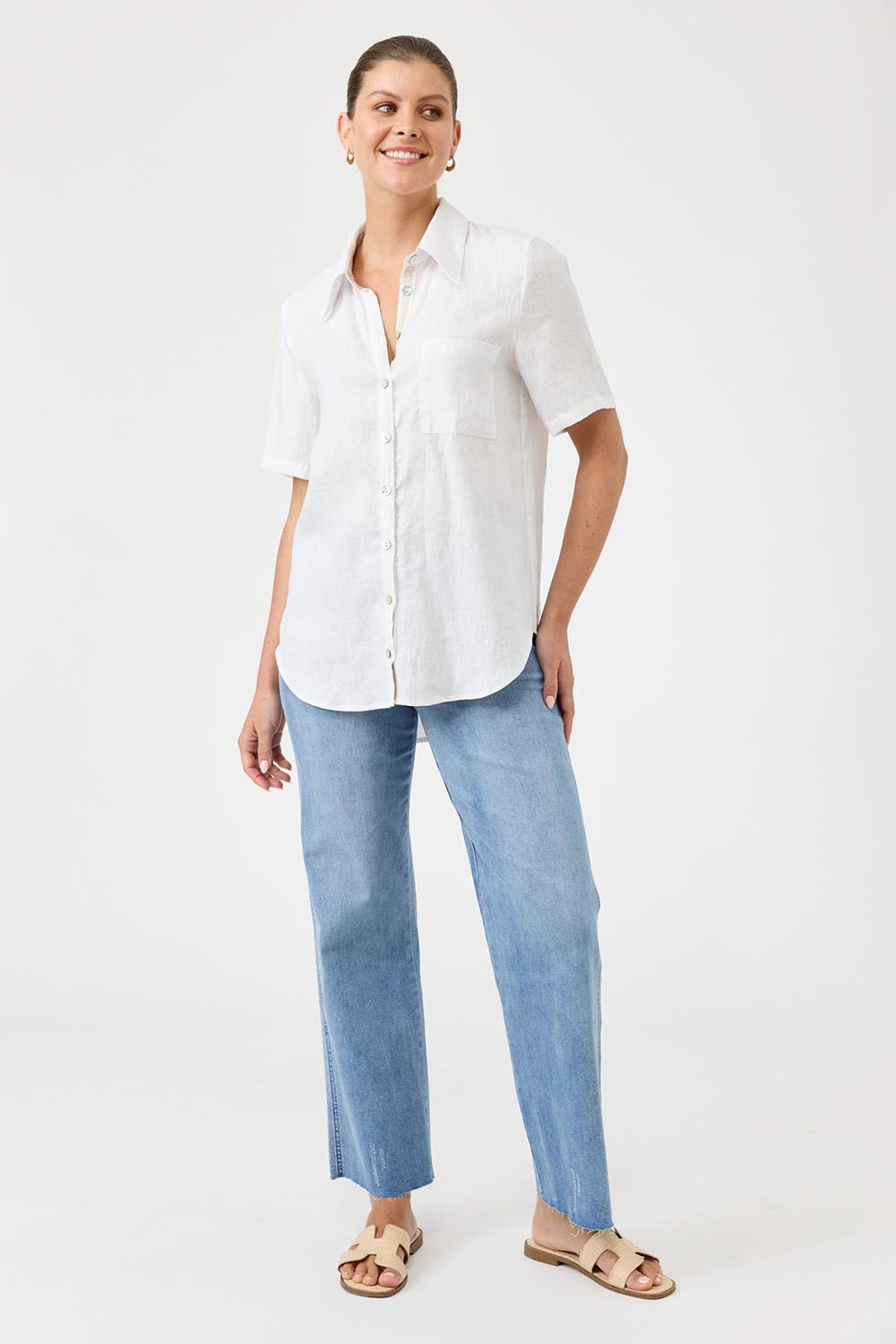 A model wearing the Studio Linen Short Sleeve Shirt in colour White (White), from the front, showing the whole outfit