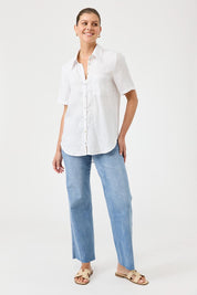 A model wearing the Studio Linen Short Sleeve Shirt in colour White (White), from the front, showing the whole outfit
