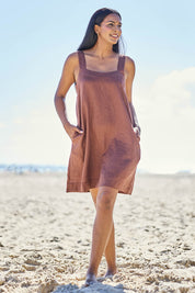 Model Eshan wearing size 10 of the Studio Linen Short Tank Dress – Chocolate in colour Chocolate, from the front