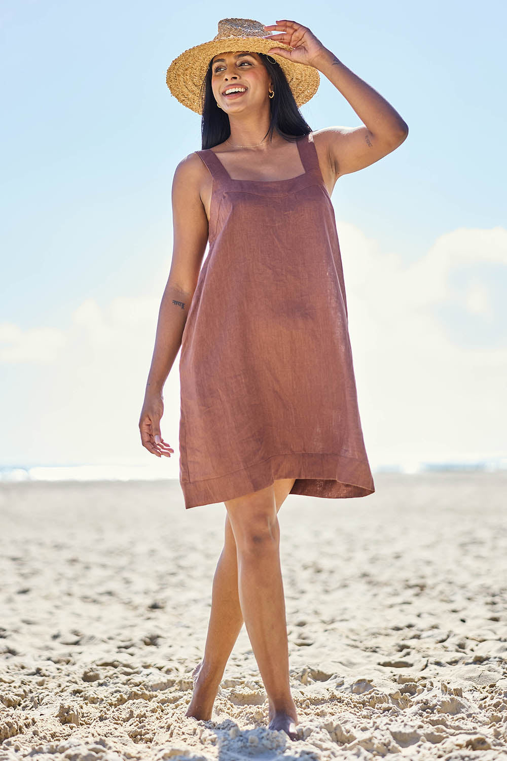 Model Eshan wearing size 10 of the Studio Linen Short Tank Dress – Chocolate in colour Chocolate, from the front