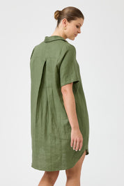 A model wearing the Studio Linen Short Shirt Dress in colour Khaki (Green), from the back